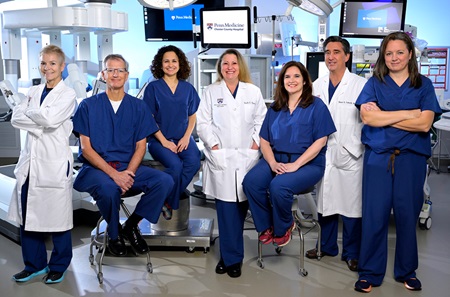 The Penn Surgical Specialists' team poses for a group photo in the robotic operating room at Chester County Hospital